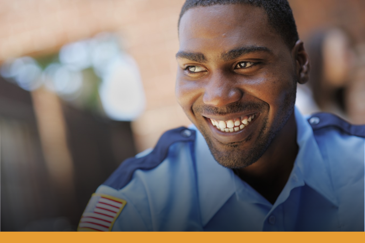 Private Protective Services Smiling face of a man wearing a security guard uniform