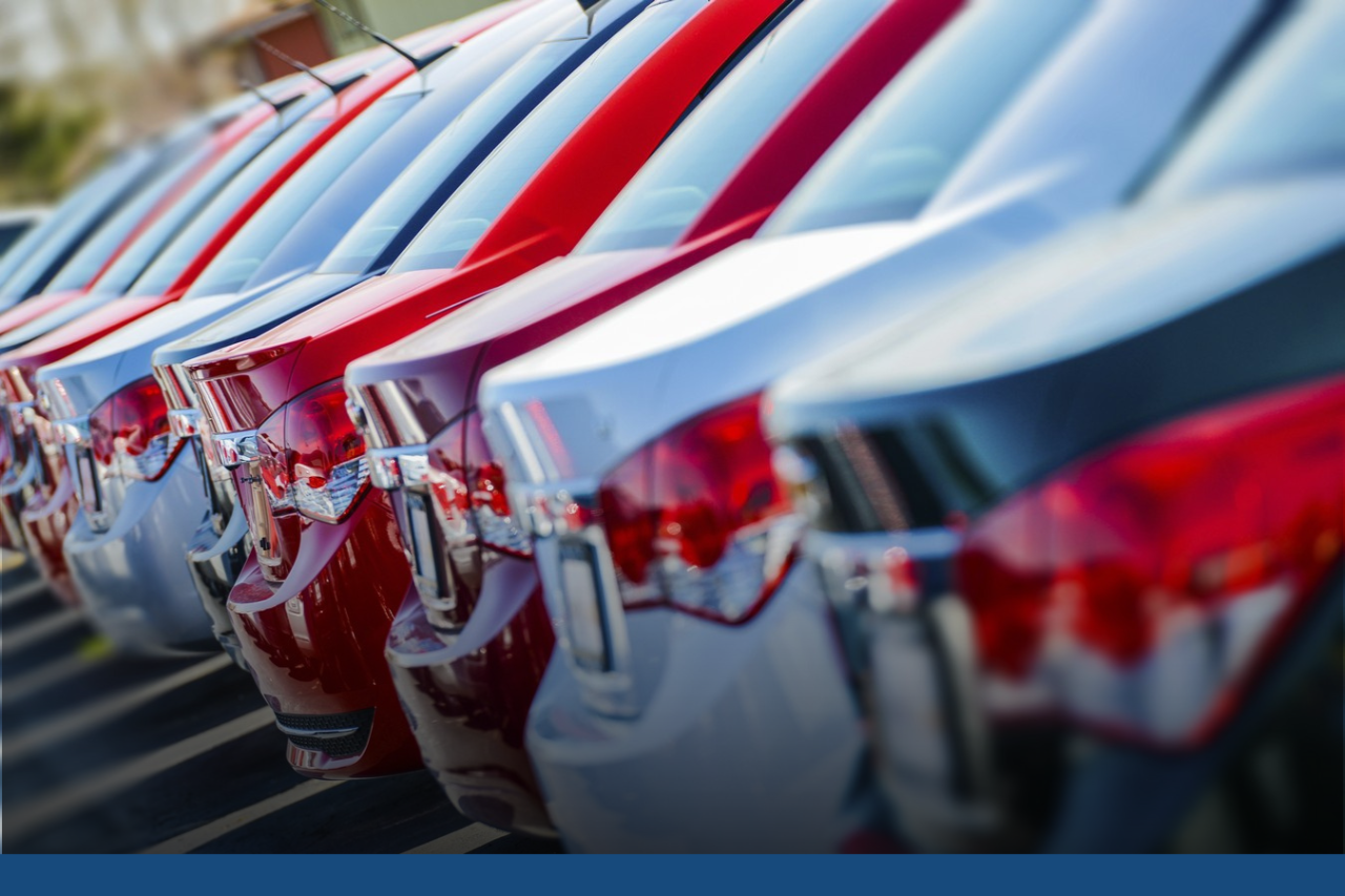 Motor Vehicle Back of many cars lined up in a row