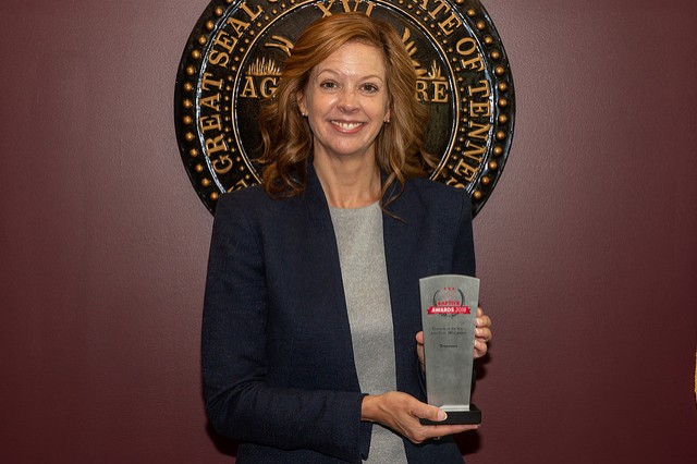 Commissioner Julie Mix McPeak with Captive Insurance Award