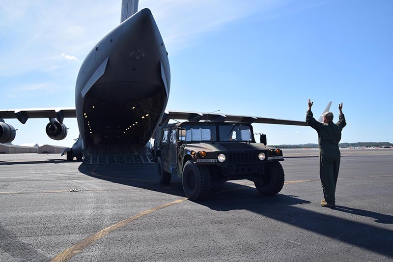 A Tenn. Air National Guard loadmaster guides a HMMWV onto a C-17 Globemaster from Memphis as part of a contingency of Military Police from the 252nd MP Co., Tenn. Army National Guard in Smyrna.  The 252nd is headed to the US Virgin Islands for continued support of the Hurricane Irma relief effort.  (Tenn. National Guard photo by CW4 Nick Atwood)