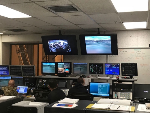A team of engineers, experimental test pilots and NASA scientists sit in a control room to supervise the Future Vertical Lift Scenarios taking place in NASA’s Vertical Motion Simulator March 15. Photo by Lt. Col. Jay Deason.