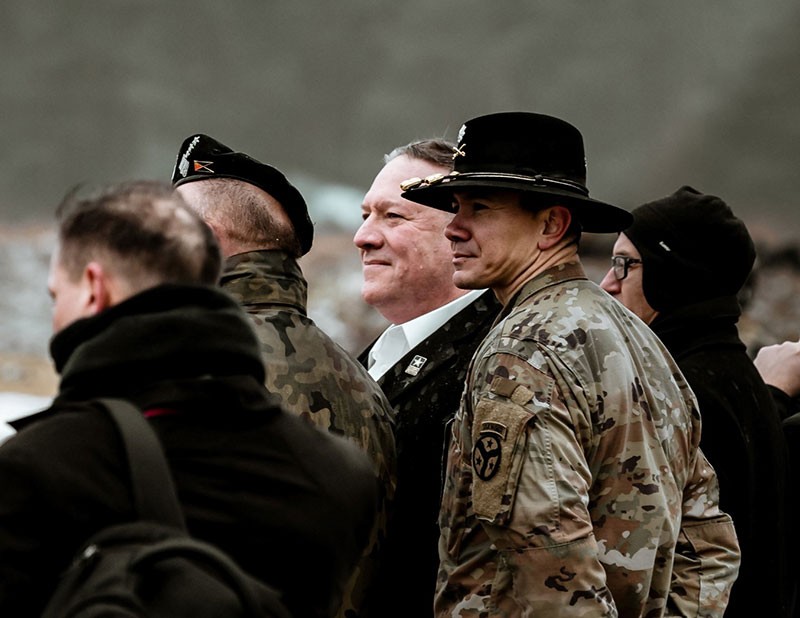 U.S. Secretary of State Michael R. Pompeo and Lt. Col. Donny Hebel from Tennessee’s 278th Armored Cavalry Regiment and commander of the U.S. Enhanced Forward Presence Battalion in Poland watch as Tennessee soldiers conduct a live fire exercise with Bradley Fighting Vehicles at the Bemowo Piskie Training Area in Poland on February 13, 2019. 