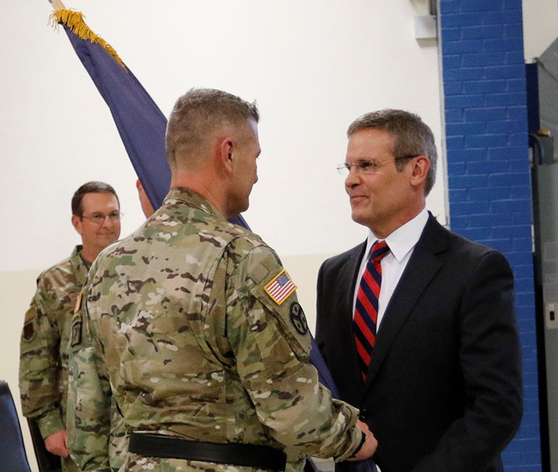 Maj. Gen. Jeff Holmes, Tennessee’s 76th Adjutant General, receives the Military Department flag from Tennessee Governor Bill Lee during a change of command ceremony at the Joint Force Headquarters in Nashville on March 3, 2019. (U.S. Army photograph courtesy of Staff Sgt. Mathieu Perry)                           