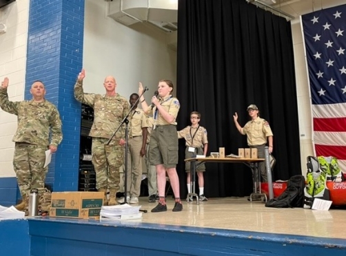 Tennessee National Guard’s Col. Jimmy Reed and Sgt. 1st Class Ken Weichert helped lead the Scout Oath during the opening ceremony of the Merit Badge University held in Nashville on April 30. (Photo by: Capt. Kealy Moriarty)