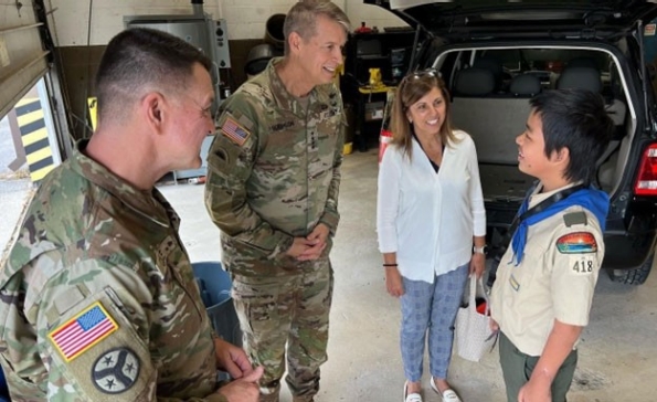 Maj. Gen. Jimmie Cole, Tennessee’s Deputy Adjutant General, Gen. Daniel Hokanson, Chief of the National Guard Bureau, and his wife, Kelly, talk with a scout participating in the automotive maintenance merit badge at the 2nd Annual Merit Badge University hosted by the Tennessee Military Department at the Joint Force Headquarters in Nashville, April 29. (official National Guard photo)