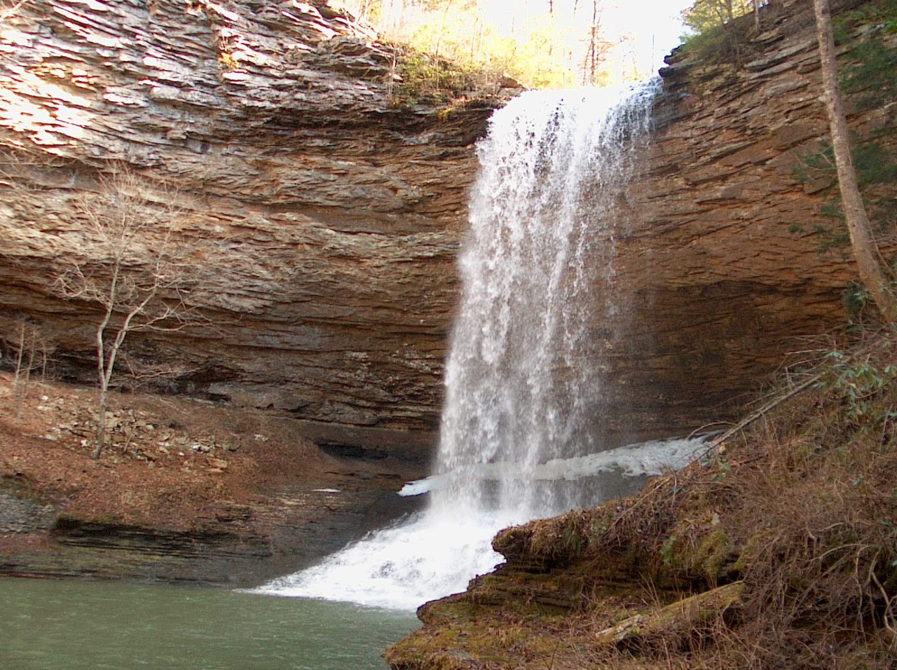 Rockwalls forming a gorge where Piney Falls waterfall drops into a pool